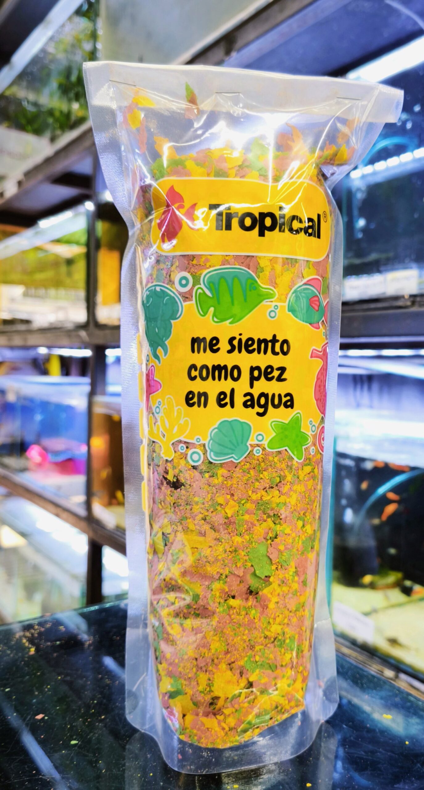 2025/08/1000240913-scaled.jpg Escamas 200g Tropical a Granel - Imagen 1